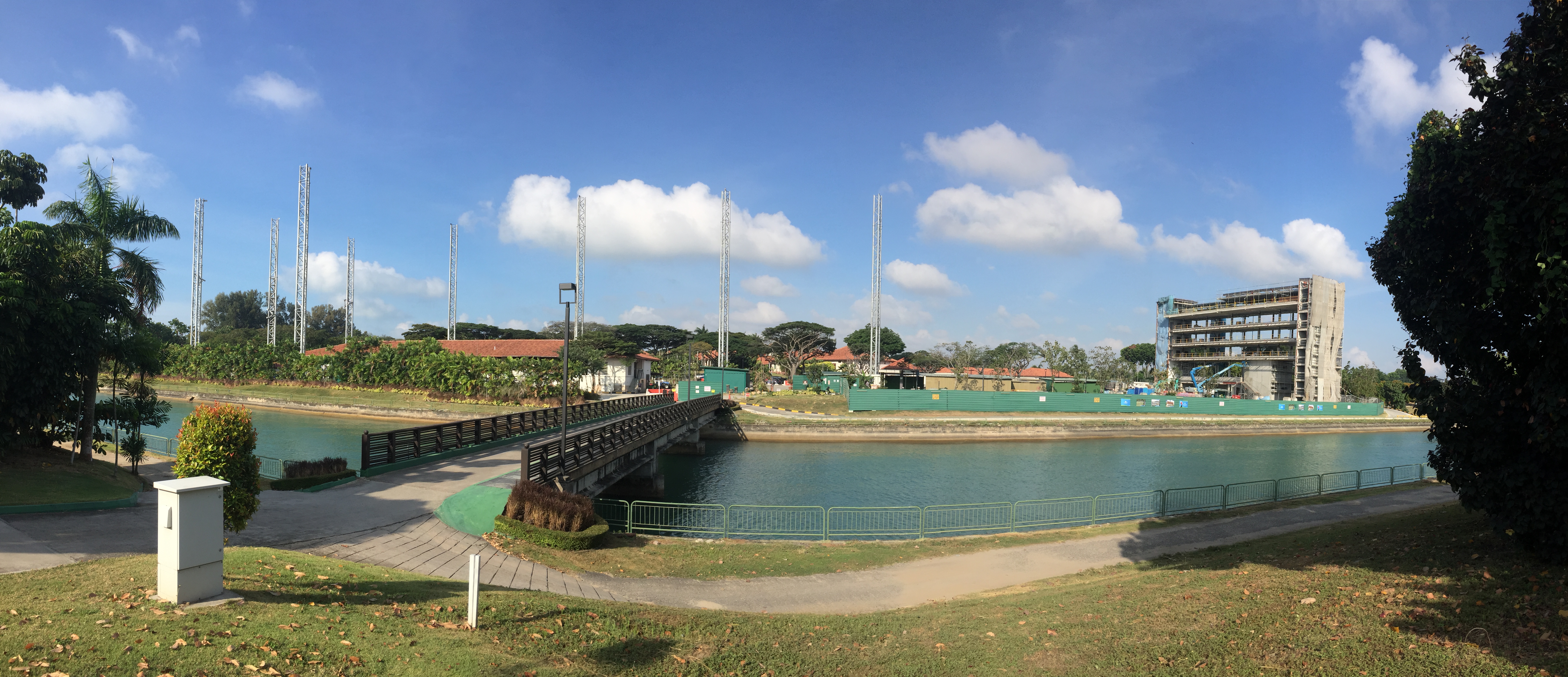 Overview of golf driving range construction site beside the canal